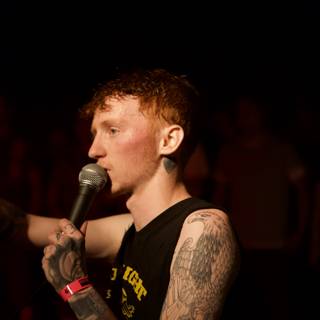 Tattooed Singer with Microphone