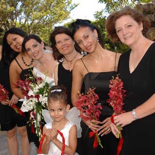 Bridesmaids in Black with Flower Girl Angel