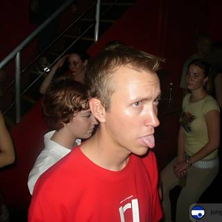 Tounge-out Teen at Nightclub Premiere