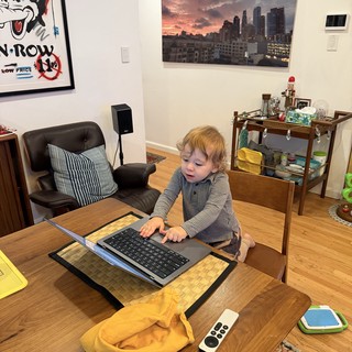 Toddler Working from Home at Wooden Desk