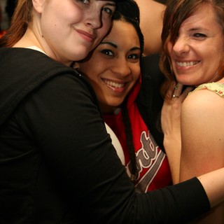Three Friends Share a Joyful Group Hug