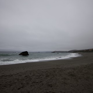 Moody Gray Skies Over Rugged California Coastal Beach