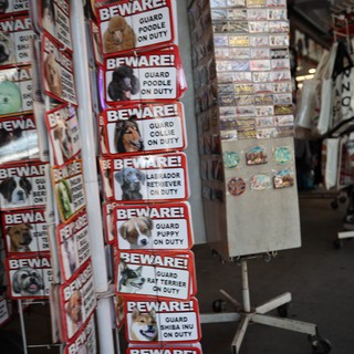 Humorous Beware Signs Display at Indoor Market