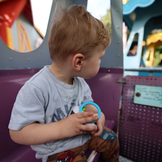 Young Boy at Fantasyland Amusement Park Ride