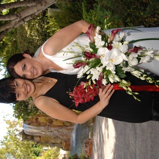 Bride and Bridesmaid Celebrate at Garden Wedding