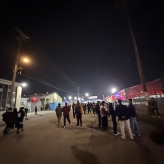 Night Crowd Gathering at Outdoor Event Venue