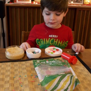 Child Crafting Christmas Ornaments with Dough Play Kit