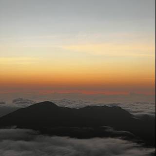 Sun rising over the clouds from Mauna Kea