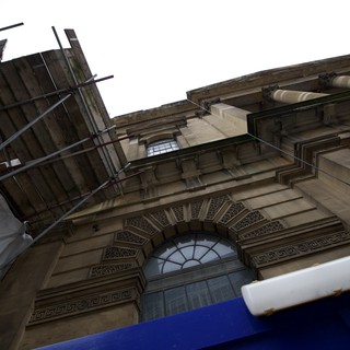 Upward View of Classical Stone Architecture Under Renovation
