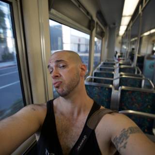 Tattooed Man on Train