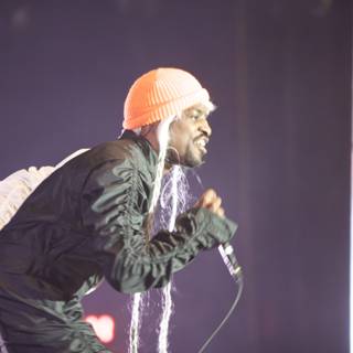 André 3000 Rocks the Stage in Orange Hat and Dreadlocks
