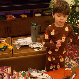 Christmas Morning Gift Opening in Festive Pajamas