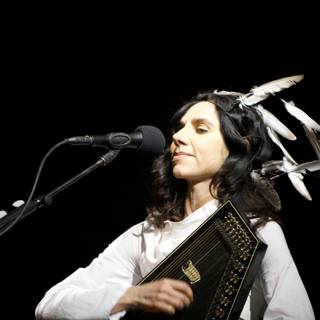 PJ Harvey performing at Coachella with Feathers in Her Hair