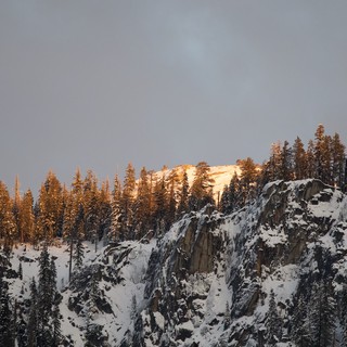 Golden Hour Illuminating Snow-Covered Yosemite Cliffs