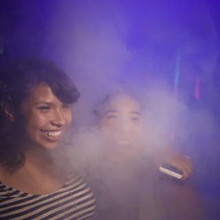 Smiling Ladies Enveloped in Smoke