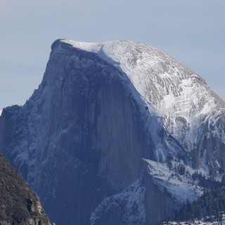 Half Dome's Snow-Covered Granite Face in Winter
