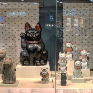 Feline Figurines in a Window Display
