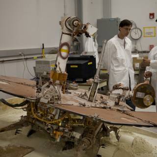 Two Men in White Coats at JPL Factory