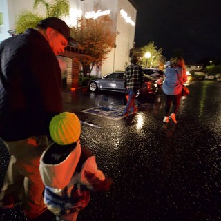 Halloween Night Trick-or-Treating in Rainy Neighborhood