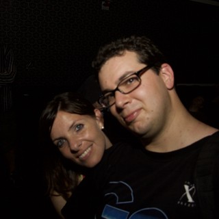 Dave and Penelope Smiling at a Nightclub Event
