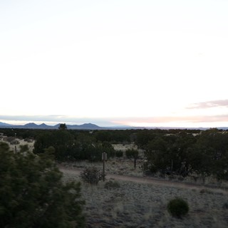 Desert Twilight Over Distant Mountain Ranges