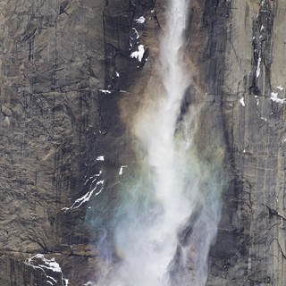 Powerful Waterfall Cascading Down Yosemite's Granite Cliff Face