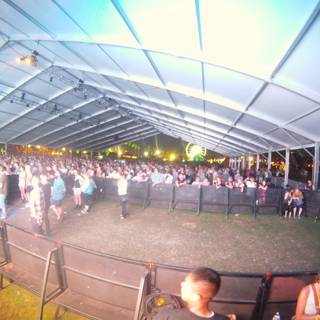 Concert Crowd in Outdoor Tent Venue