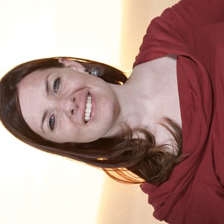 Smiling Woman in Red at Golden Hour