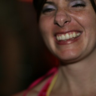 Joyful Woman Laughing at a Nighttime Event