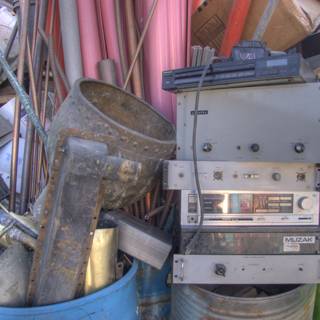 Radio and Other Devices amidst Pile of Manufacturing Waste