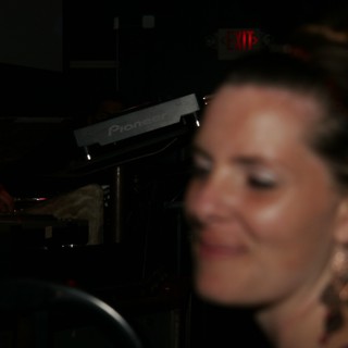Blurred Portrait of Woman Near DJ Equipment Nightclub