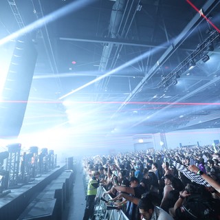 Massive Indoor Rave Crowd Engulfed in Laser Light