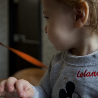 Toddler at Breakfast Table with Mickey Mouse Shirt