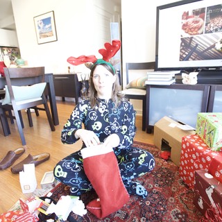 Christmas Morning Stocking Surprise in Festive Pajamas