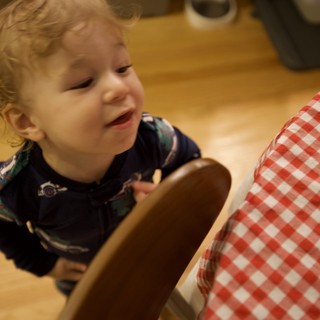 Toddler Playing with Wooden Spoon on Christmas Morning