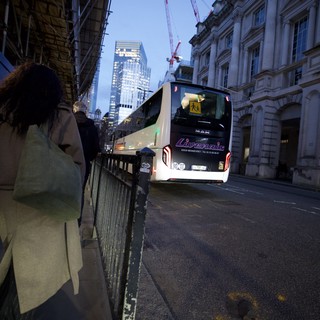 Evening Bus on London City Street at Dusk