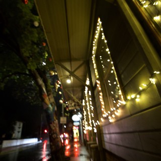Festive Night Street Scene with Holiday Lights