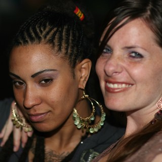 Two Friends Sharing a Moment at Nightclub Party