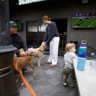 Dog-Friendly Patio Gathering at Modern Sports Bar