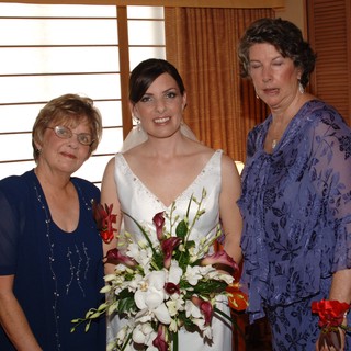 Bride Poses with Two Women on Wedding Day