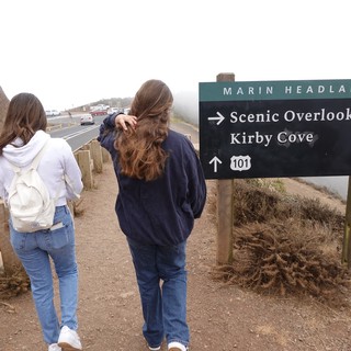 Visitors at Marin Headlands Scenic Overlook Sign