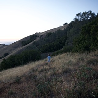 Lone Child Wandering the Golden Hills at Dusk