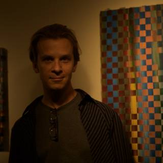 Standing before a wall of art