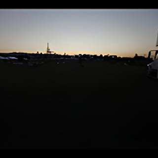 Truck parked at sunset
