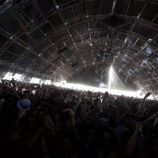 Concertgoers at Coachella Raise Hands in the Air