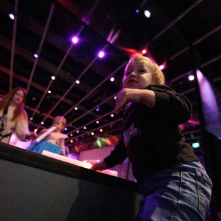 Young Child Dancing at Baby Rave Event