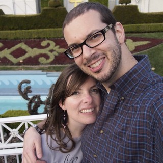 Couple Smiling Together at Decorated Garden Venue
