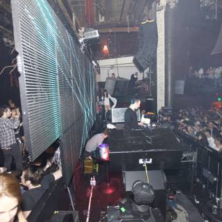 Urban Nightlife: Concert Crowd Grooving to DJ Sasha's Beats