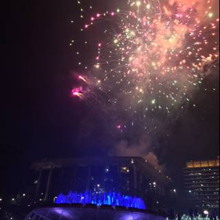 Fireworks Illuminate Summer Night over Fountain