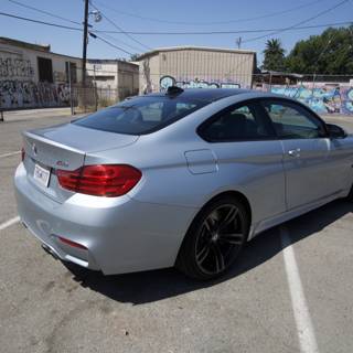 Sporty BMW M4 Coupe in a Graffiti Parking Lot